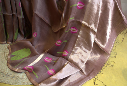 Silk linen onion color saree with lotus weaving and running plain blouse with zari